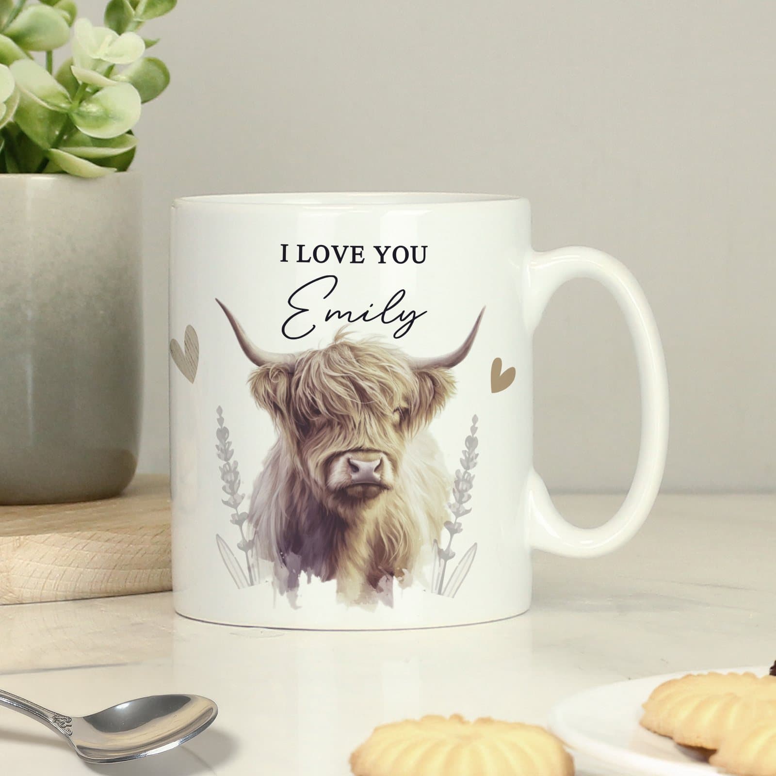 Personalised mug with a Highland cow design and lines of text