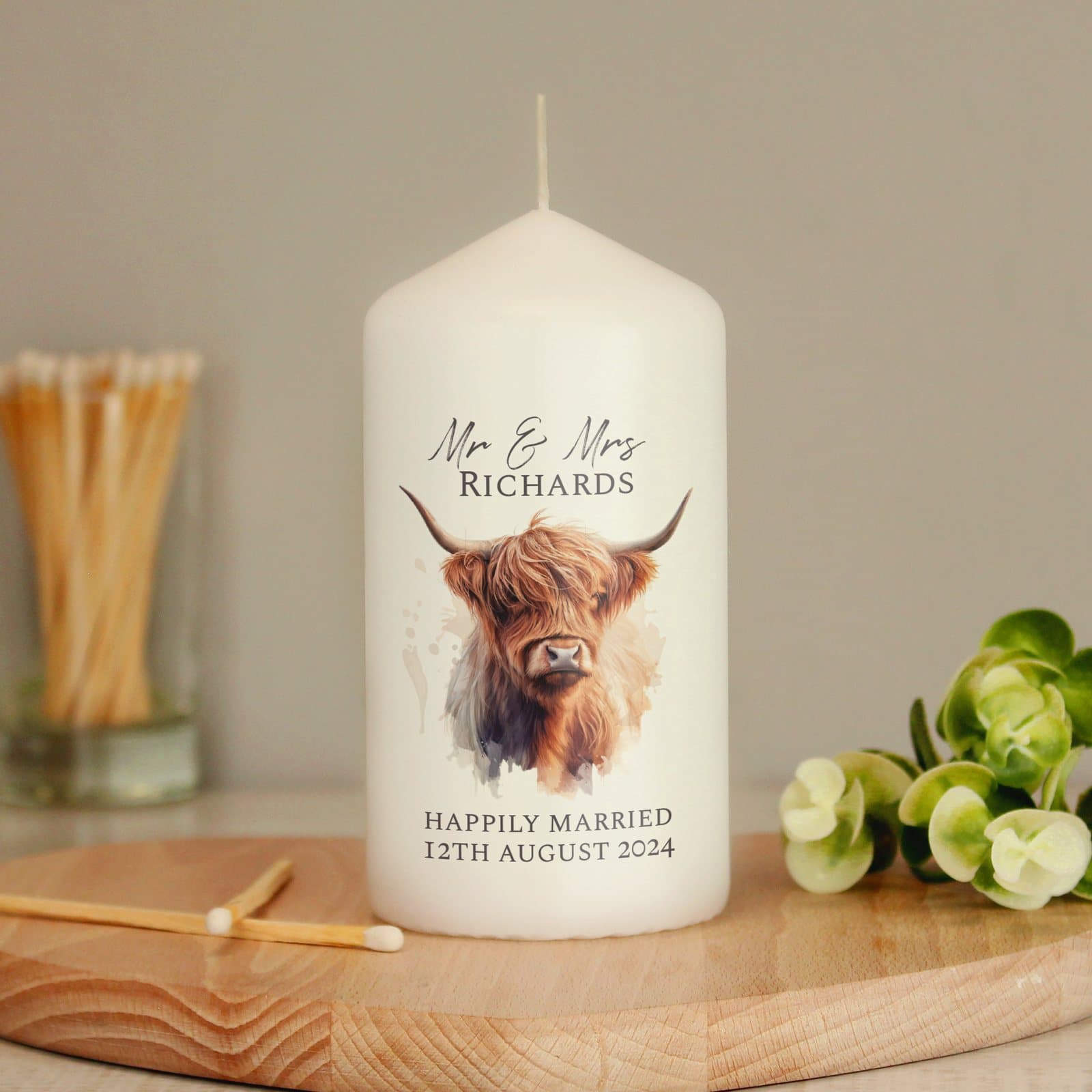 Pillar candle with a highland cow design and personalised message