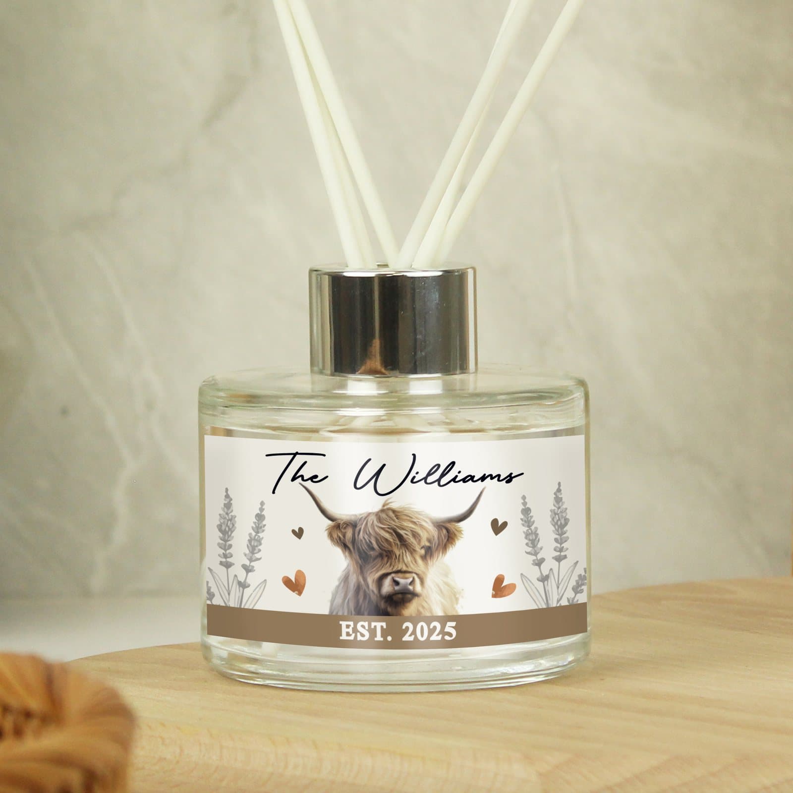 Personalised Highland cow reed diffuser in a glass bottle with reeds