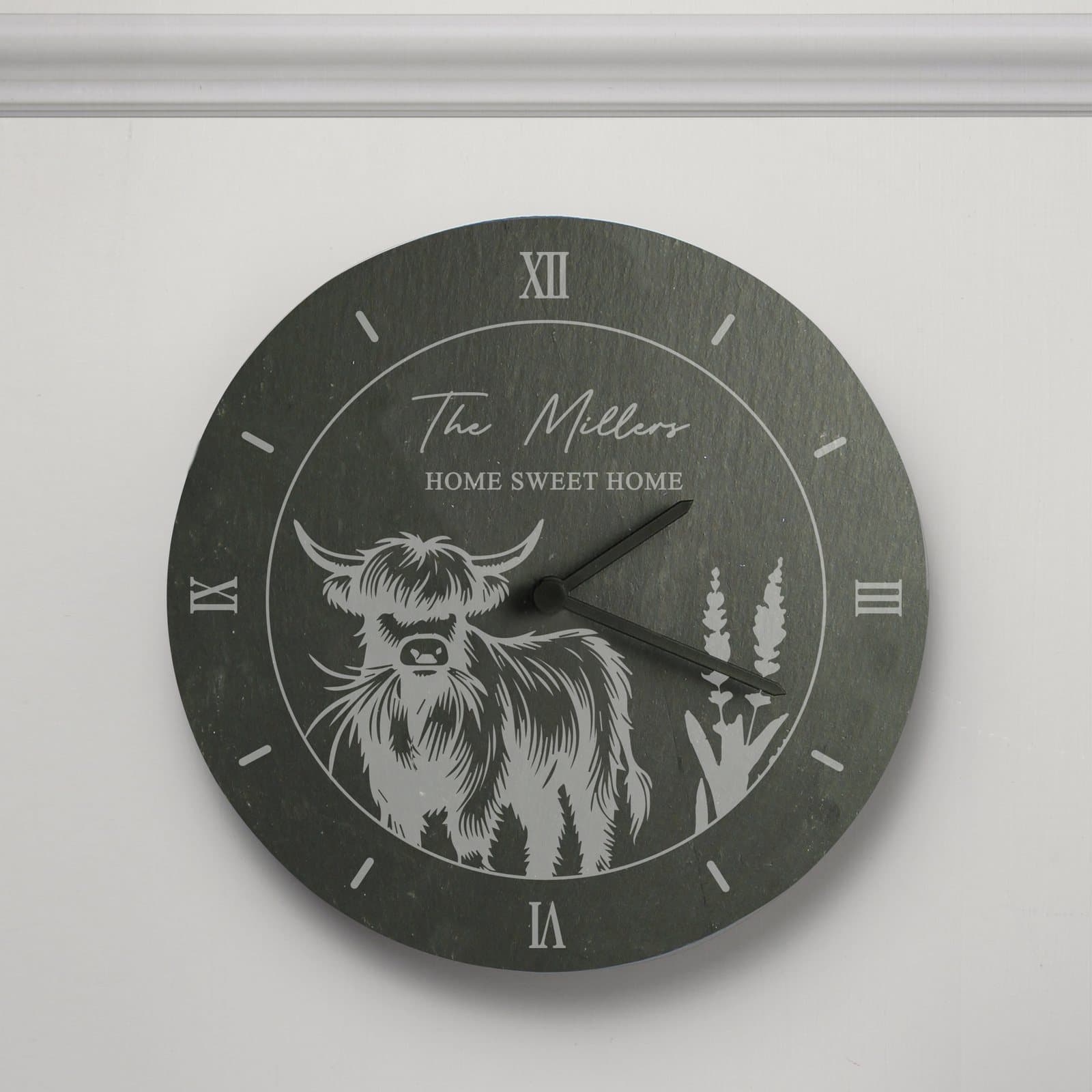 Hand-cut slate clock with a Highland cow design and personalised text