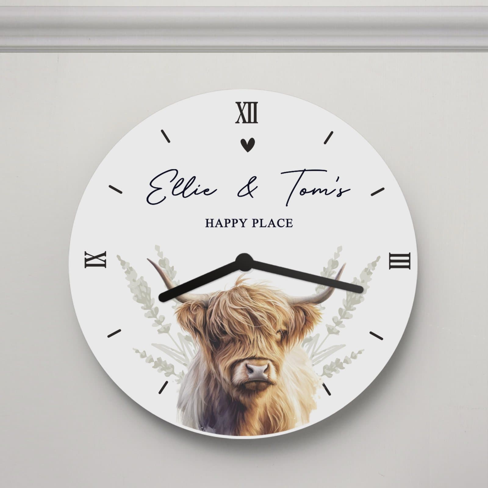 Wooden clock with a Highland cow illustration and two lines of personalised text
