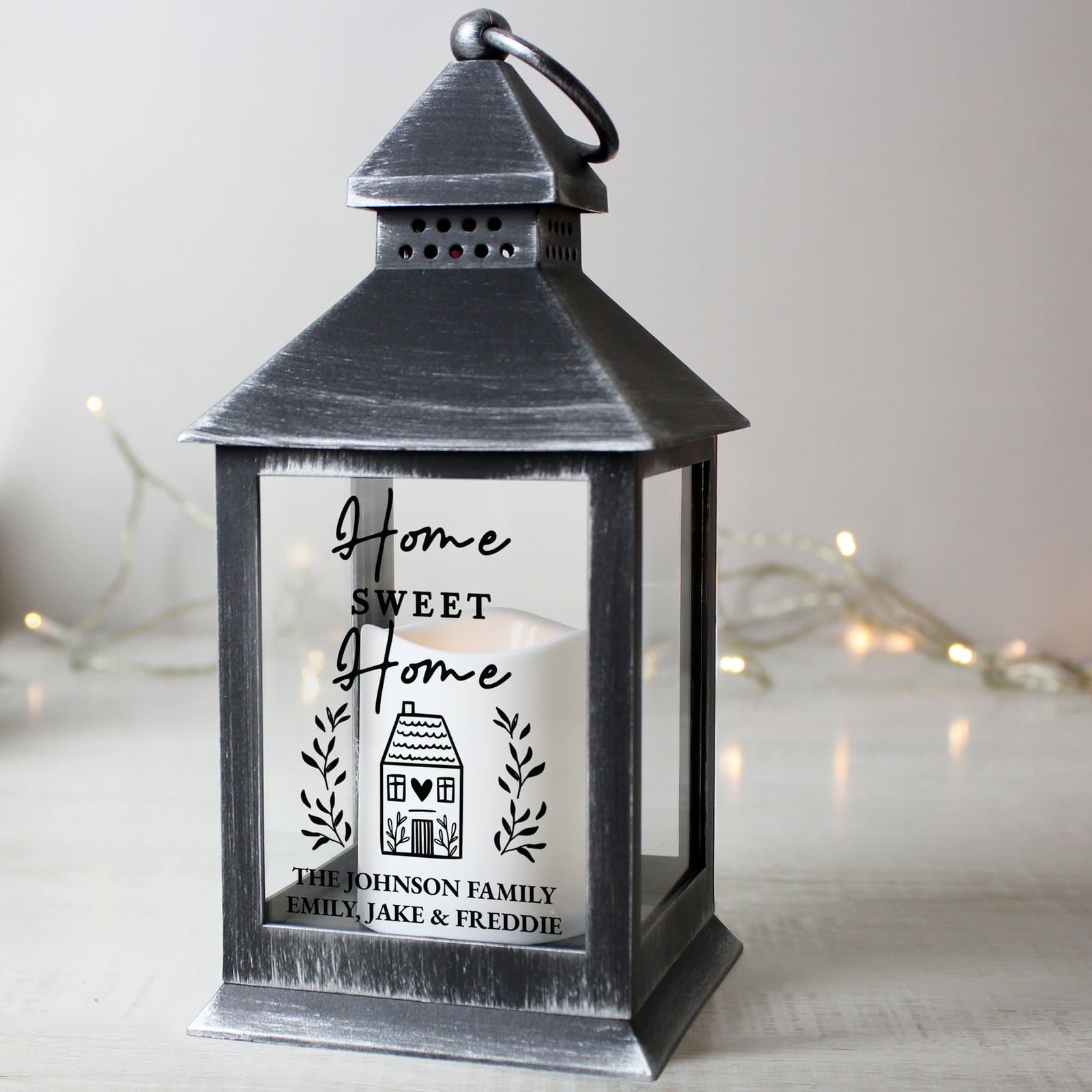 Black Home Sweet Home lantern with a hoop and a flickering orange flame effect