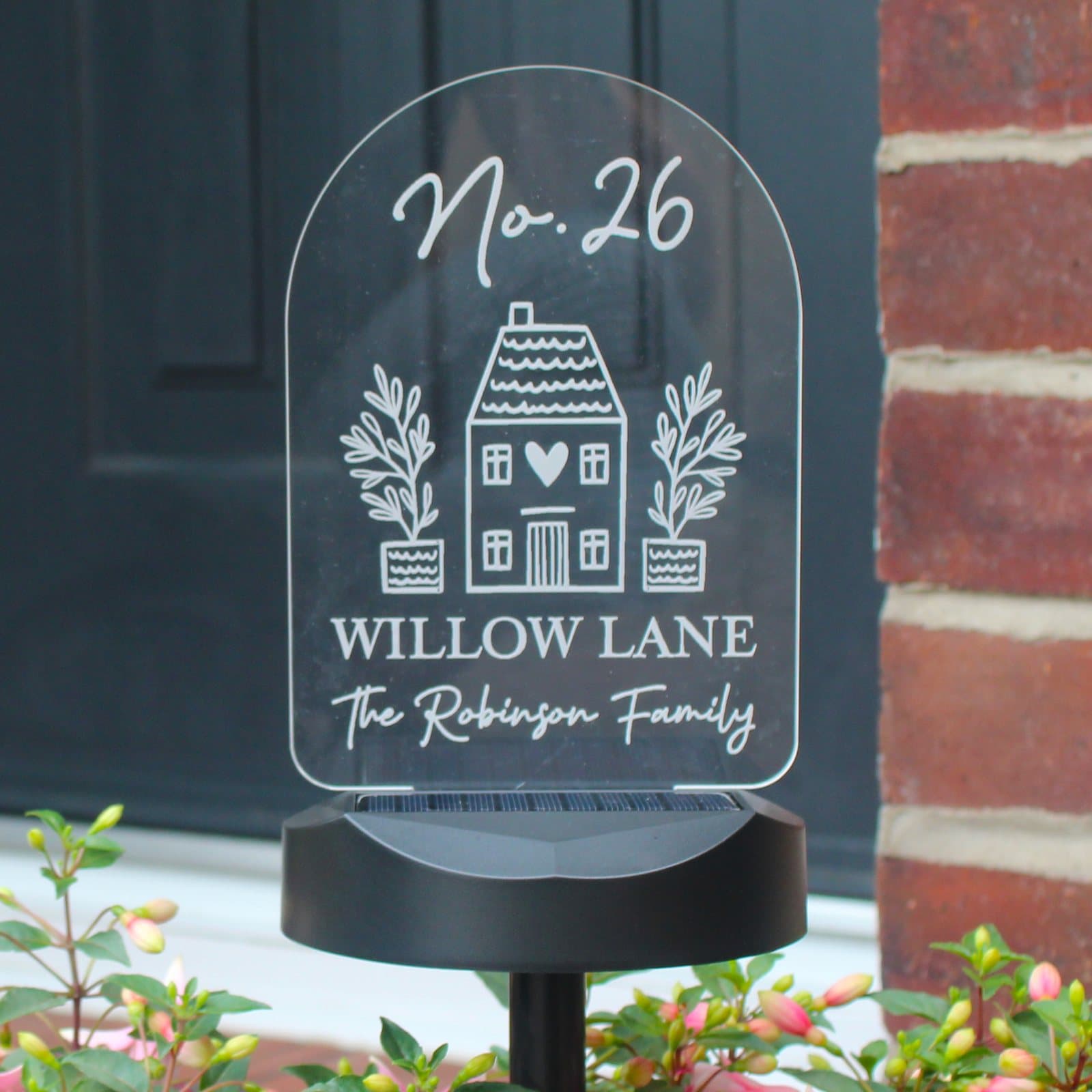 Personalised solar light sign on a ground stick with a solar panel base
