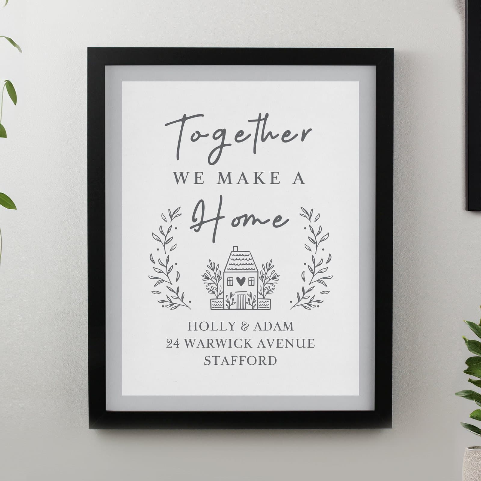 Black or white framed print reading Together WE MAKE A home with personalised lines