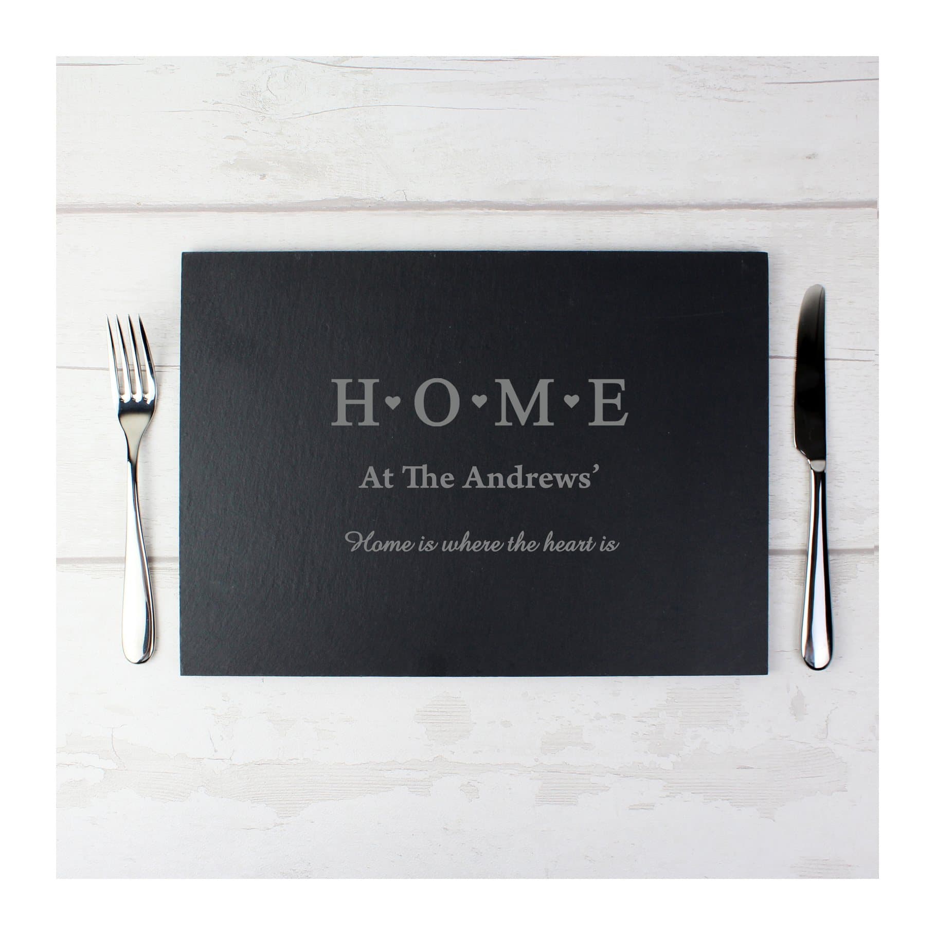 Rectangular slate placemat with H O M E and personalised surname