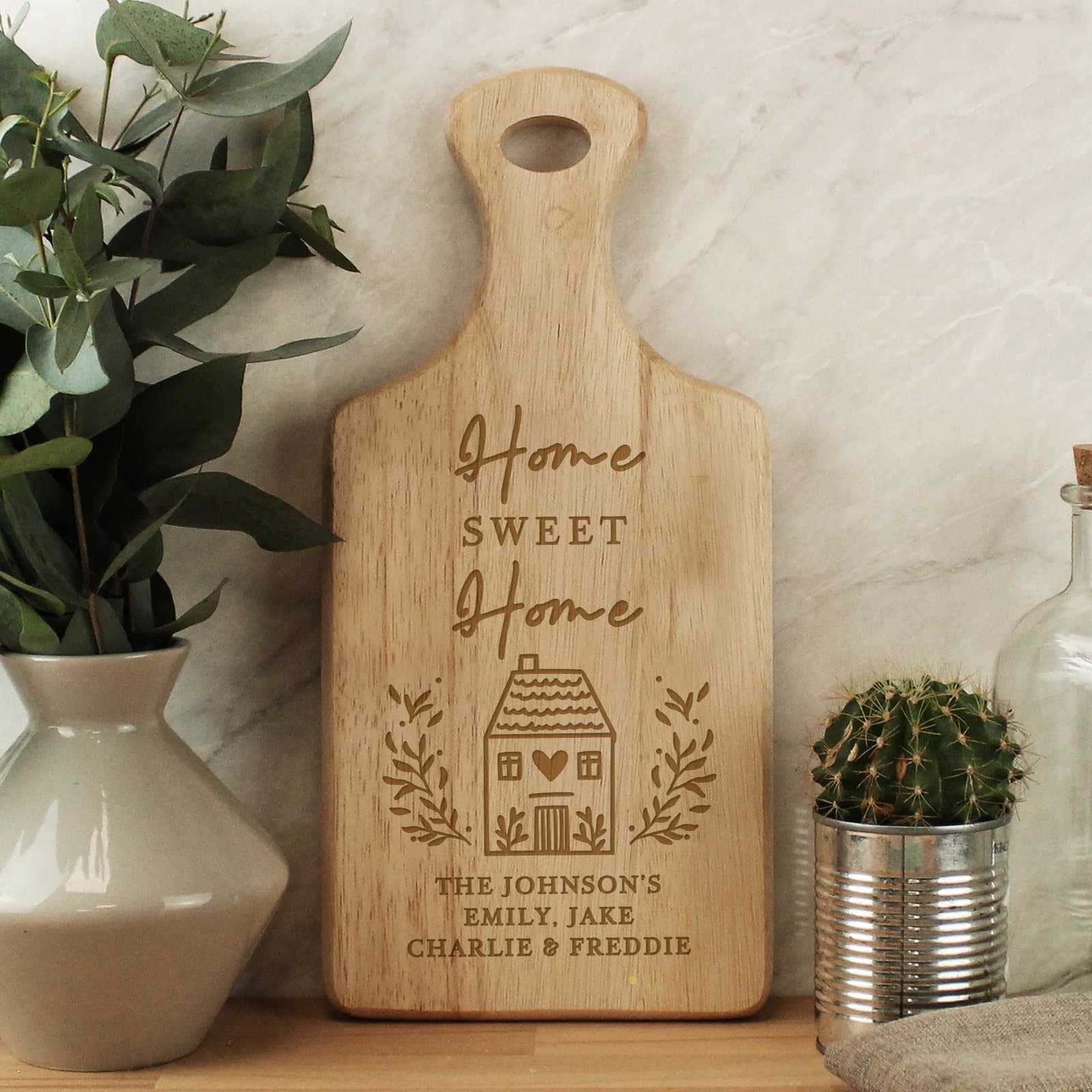 Wooden paddle board with Home Sweet Home text and three lines of personalisation