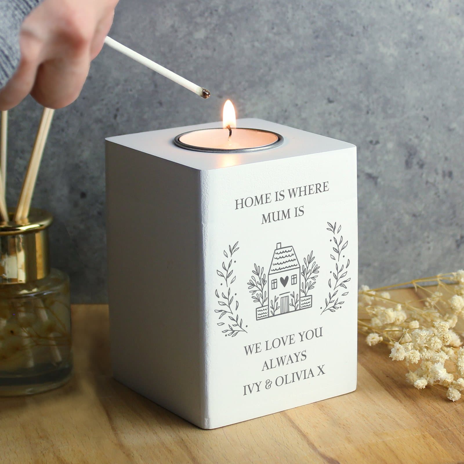 White wooden tealight holder with personalised lines of text