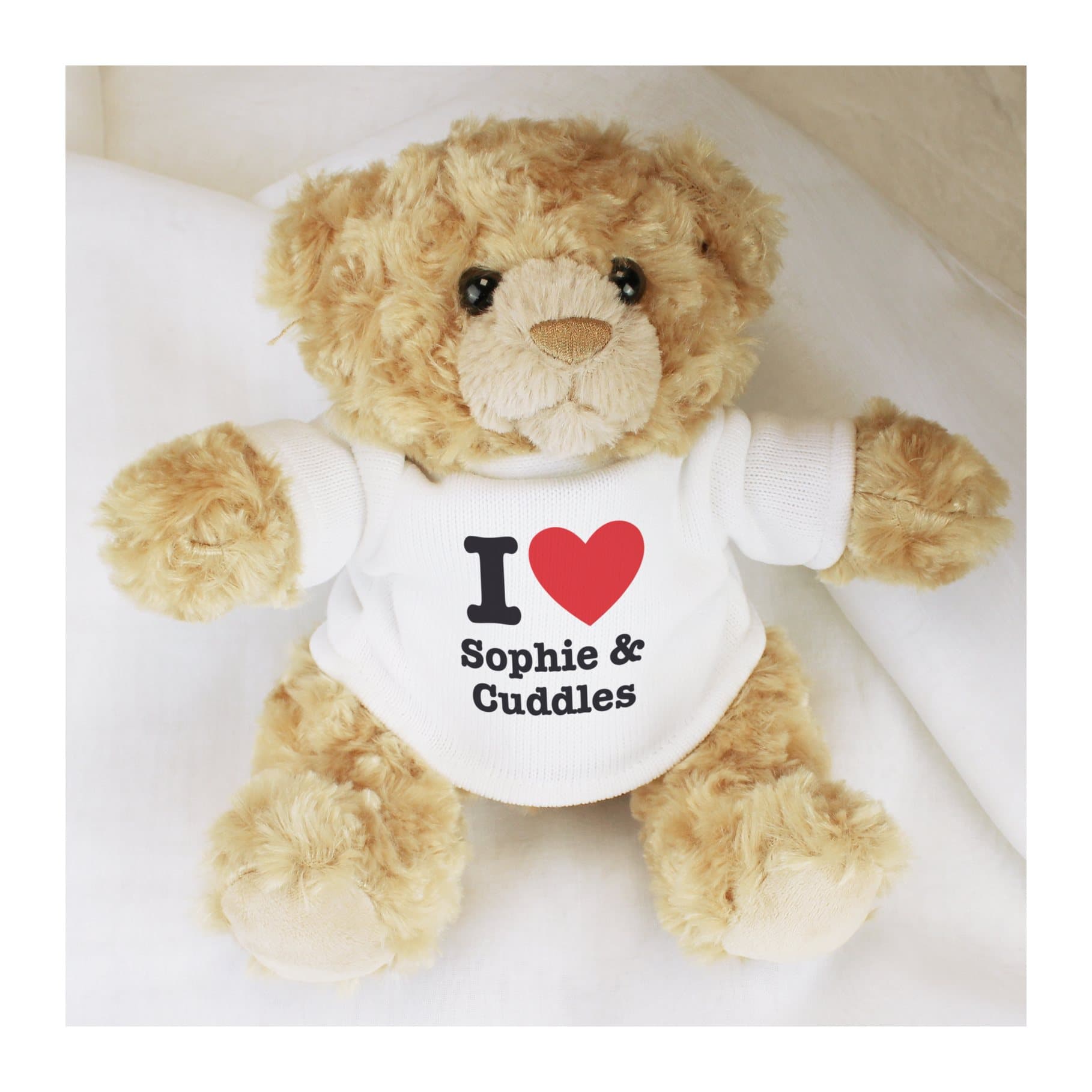 Fluffy teddy bear in a jumper with an I heart design
