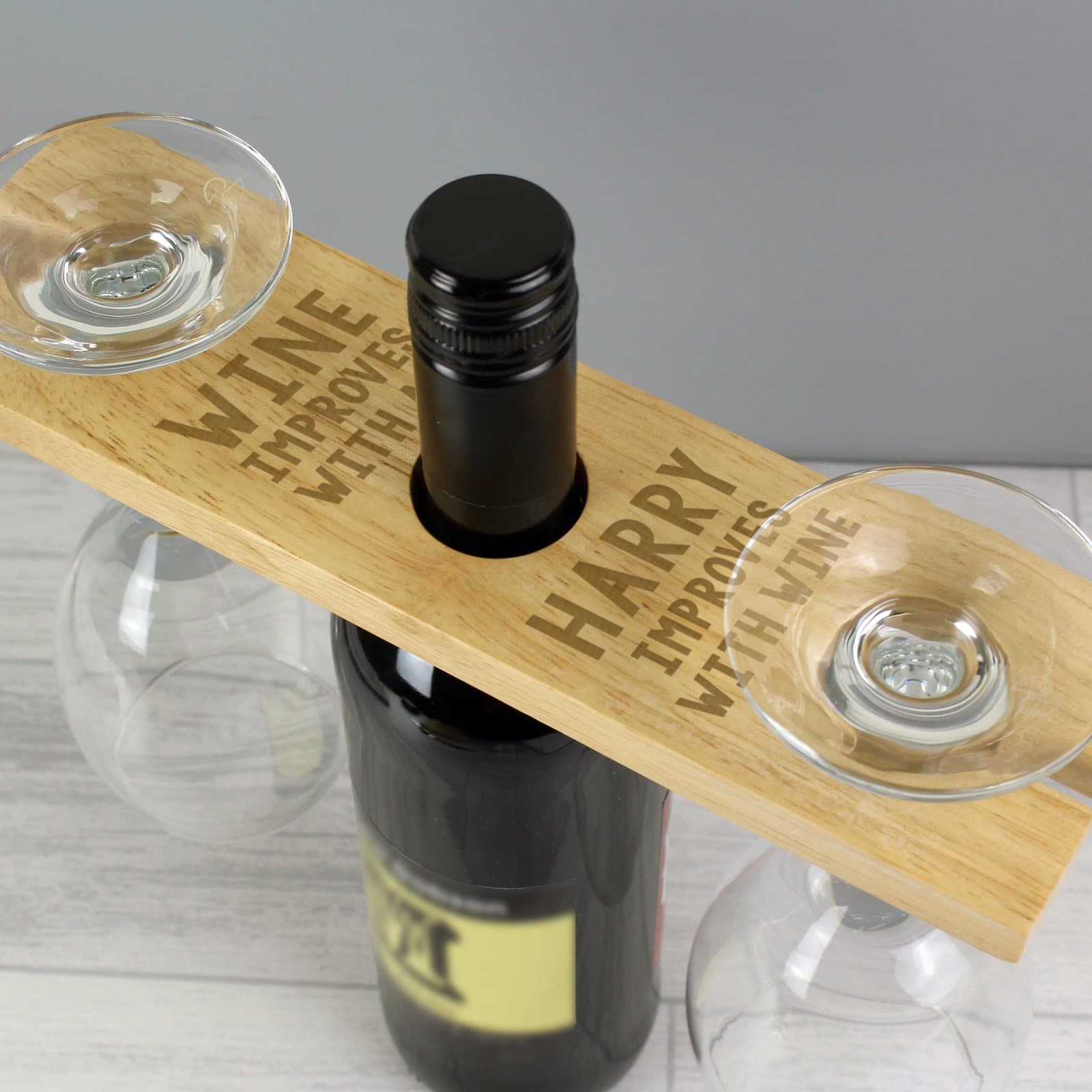 Wooden wine bottle and glass holder with a personalised name