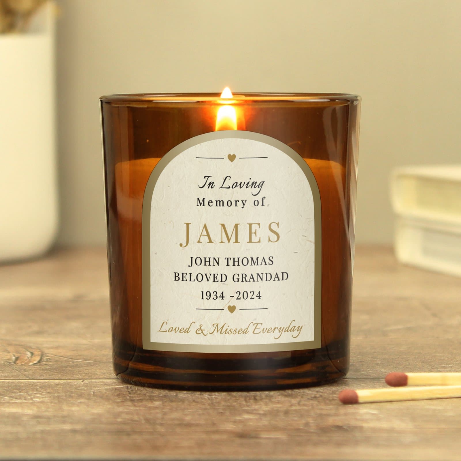 Personalised in loving memory amber glass candle with a label