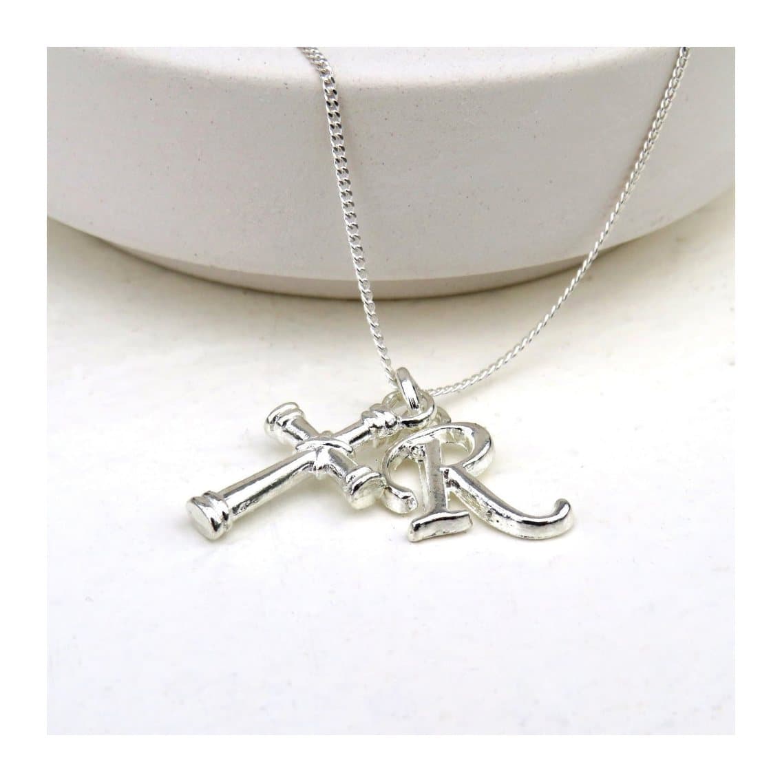 Silver plated initial cross charm necklace on a sterling silver chain