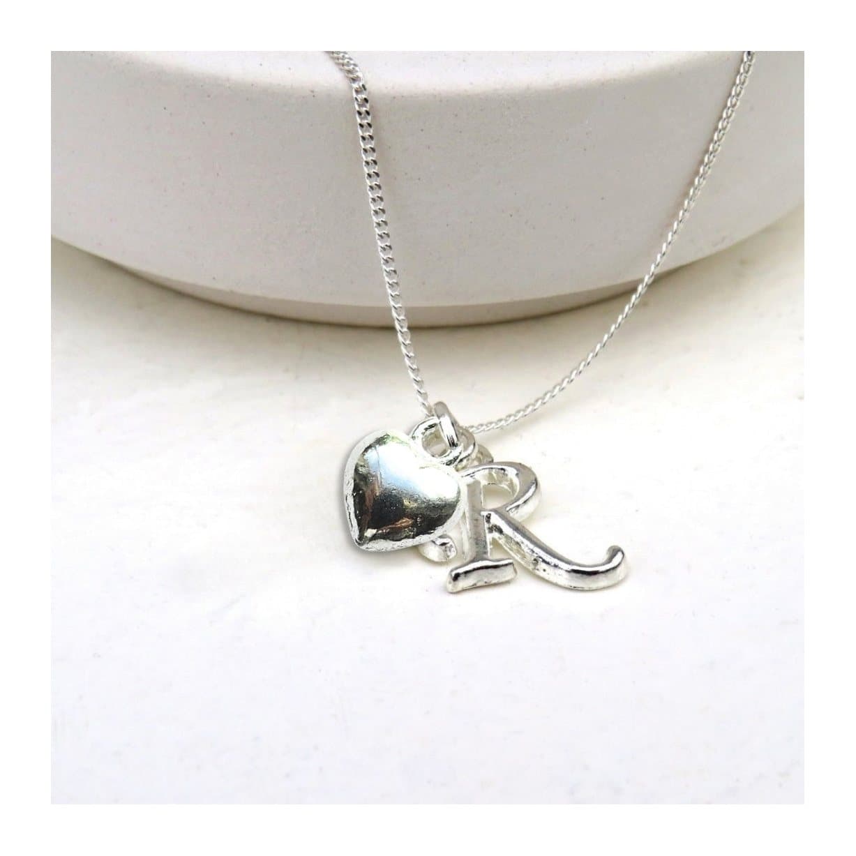 Personalised initial puff heart charm necklace on a sterling silver chain