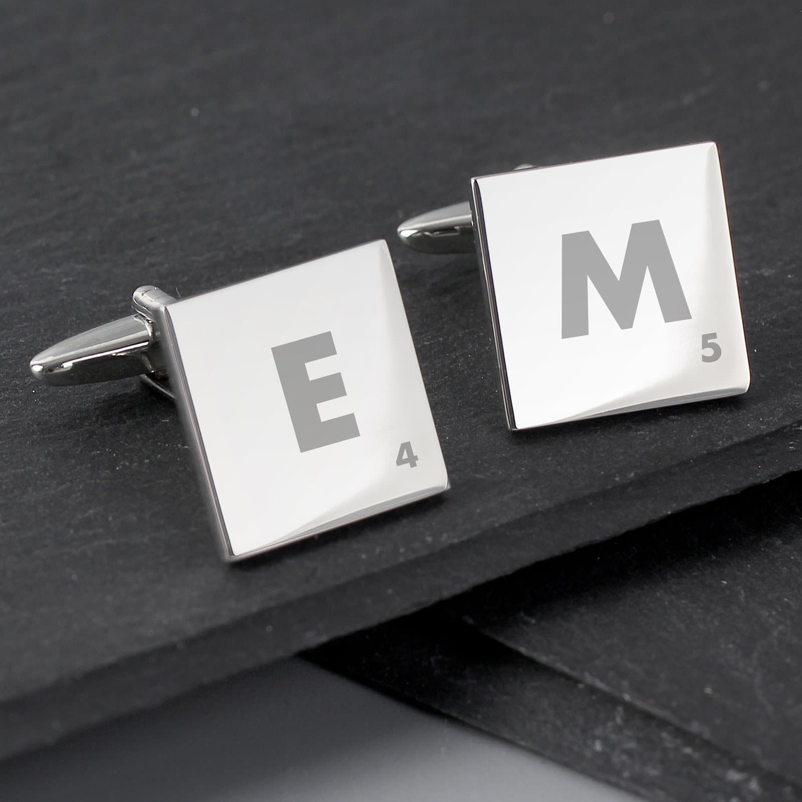 Square cufflinks with a large initial and a small number, in a black gift box