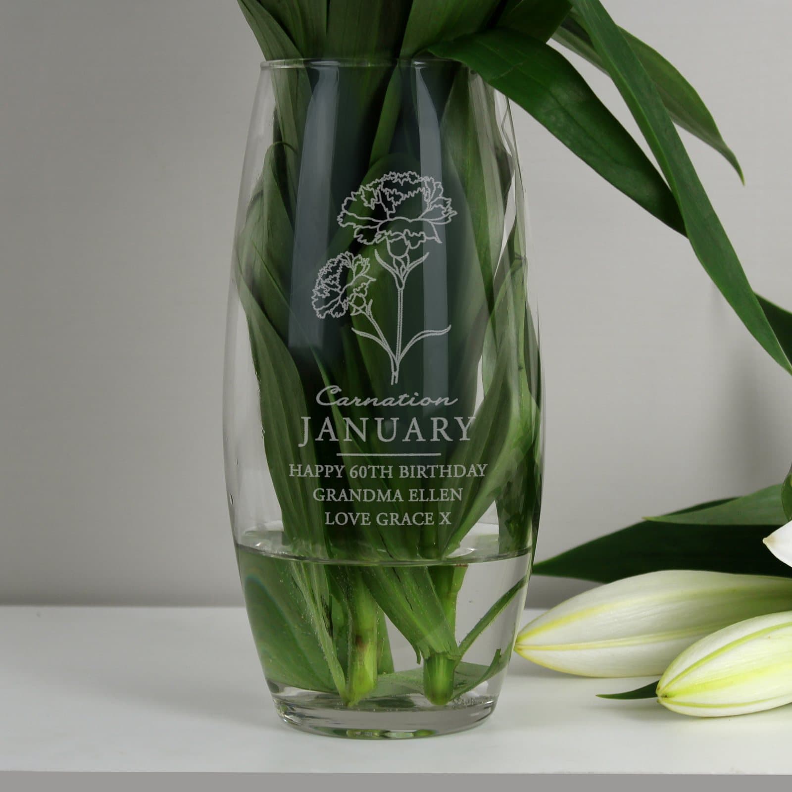 Glass bullet vase with a carnation illustration for January