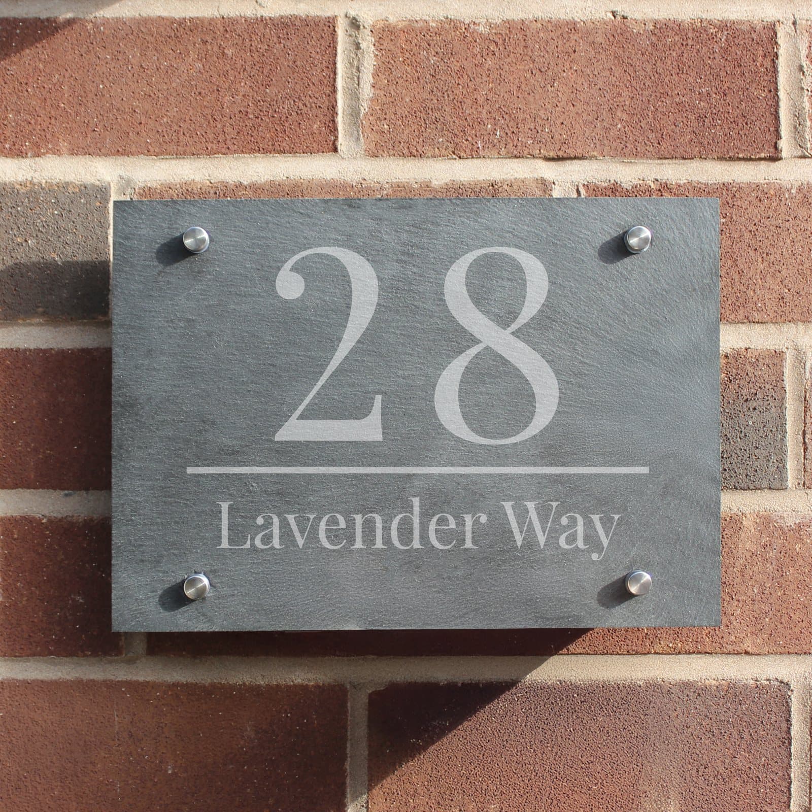 Slate house sign with a large house number and a line of text