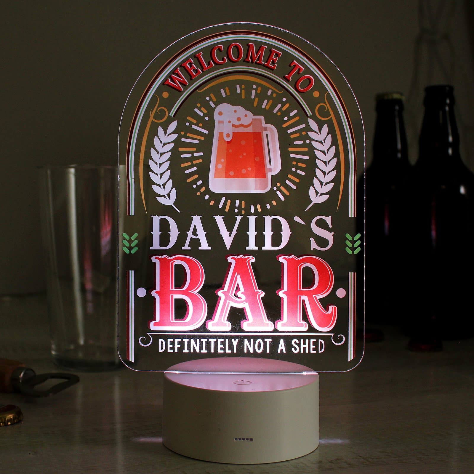 Acrylic LED bar sign with a personalised name and message lit on its base
