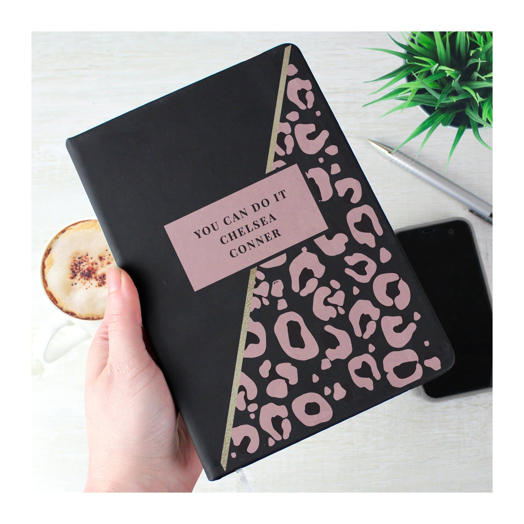 Black hardback notebook with leopard print design