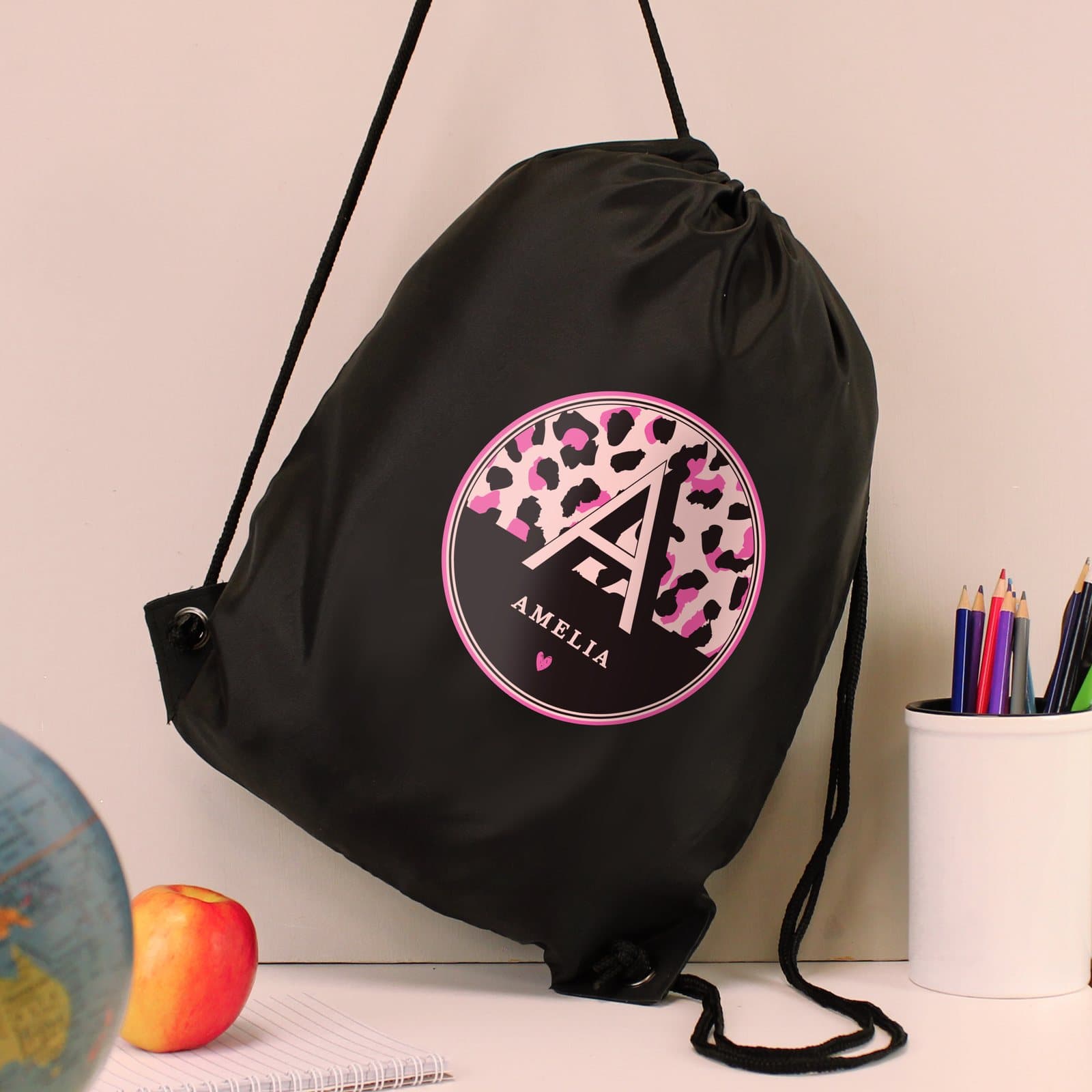 Black drawstring kit bag in leopard print