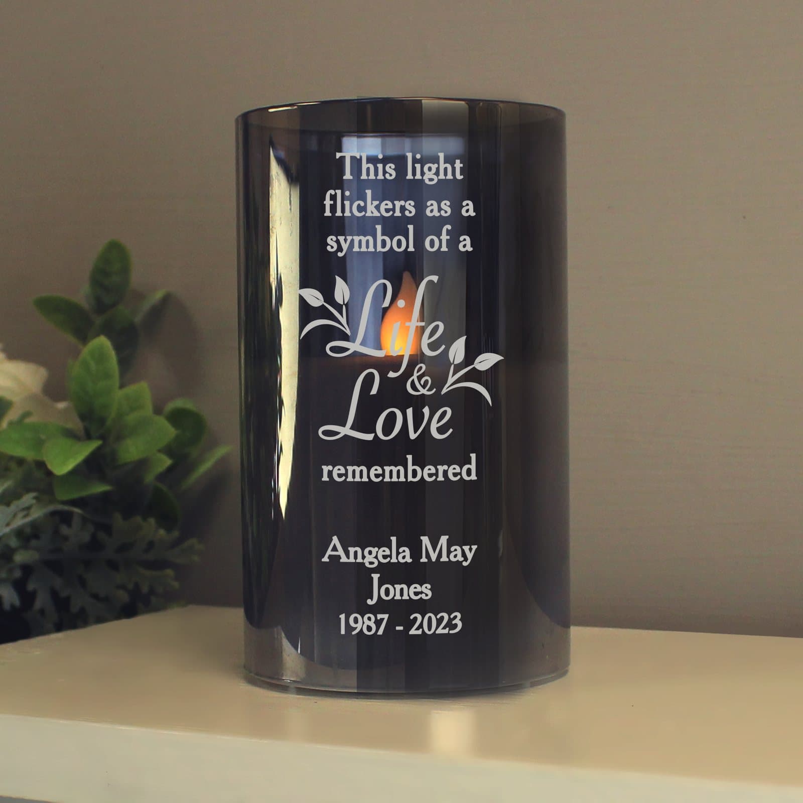 Smoked frosted glass LED memorial candle with an amber flame effect