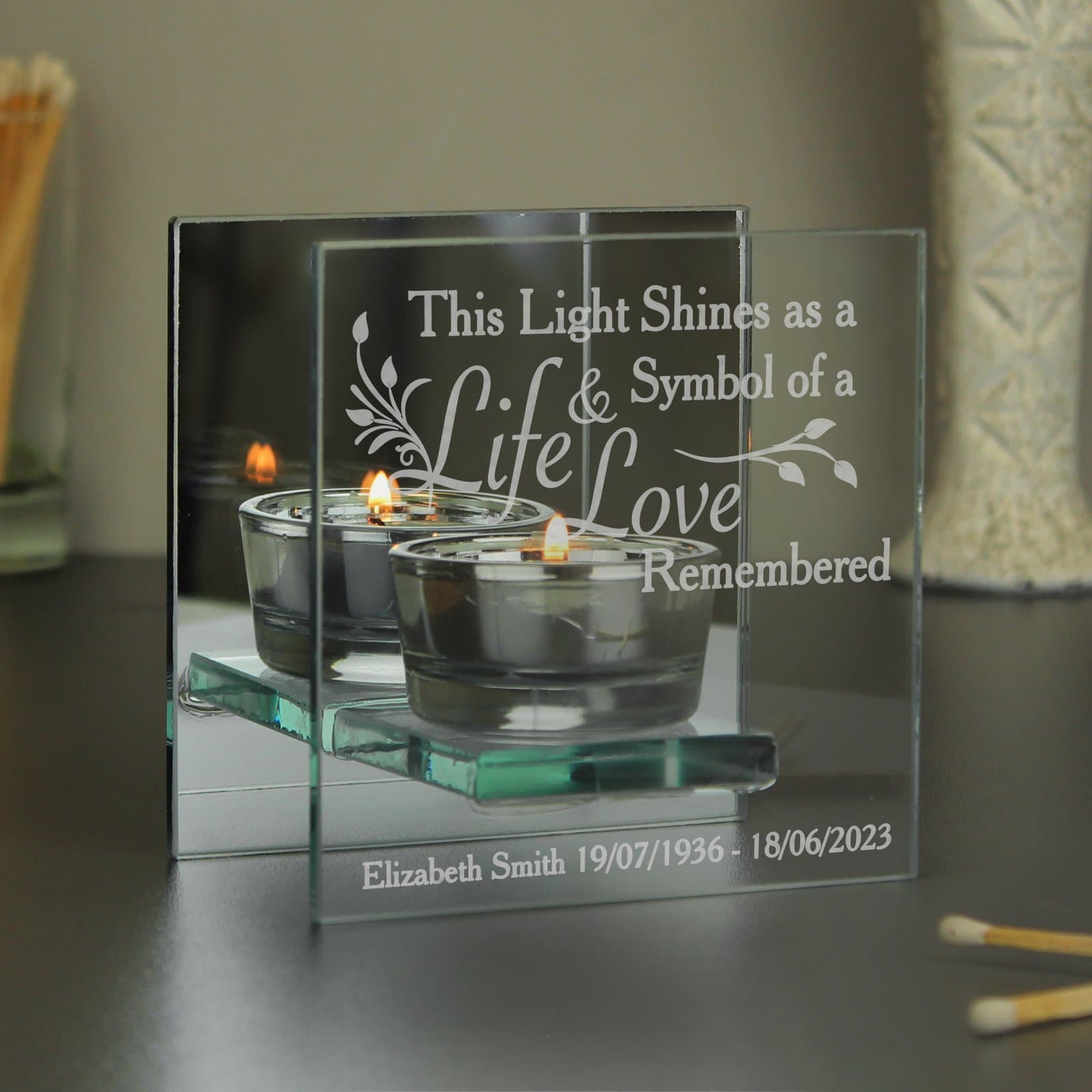 Personalised mirrored glass tea light holder with a printed message