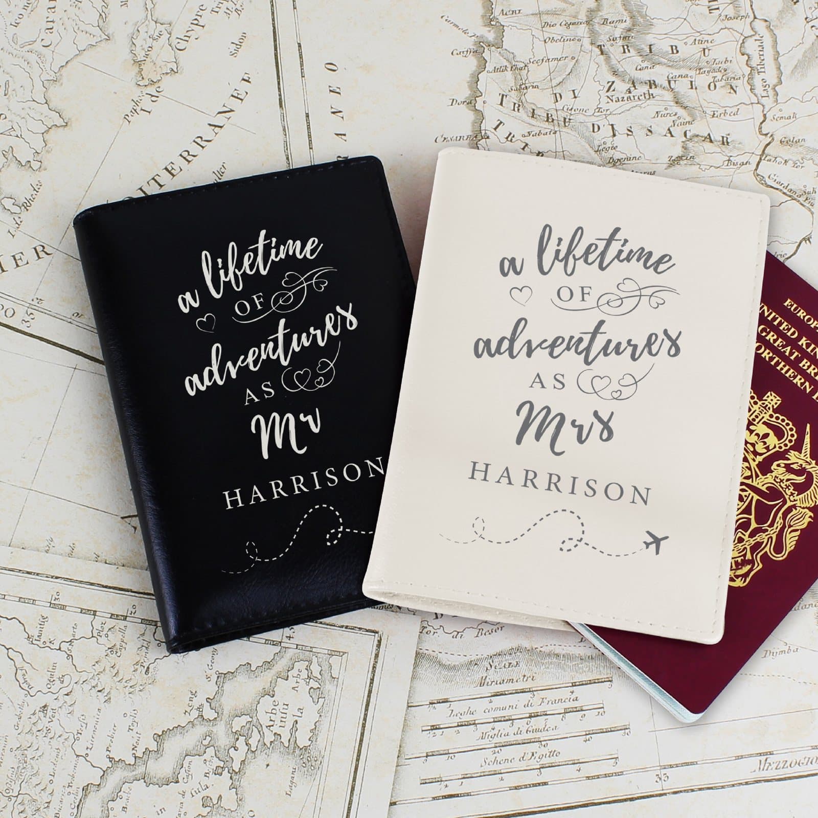 Black and cream leather passport holders with lifetime of adventures wording