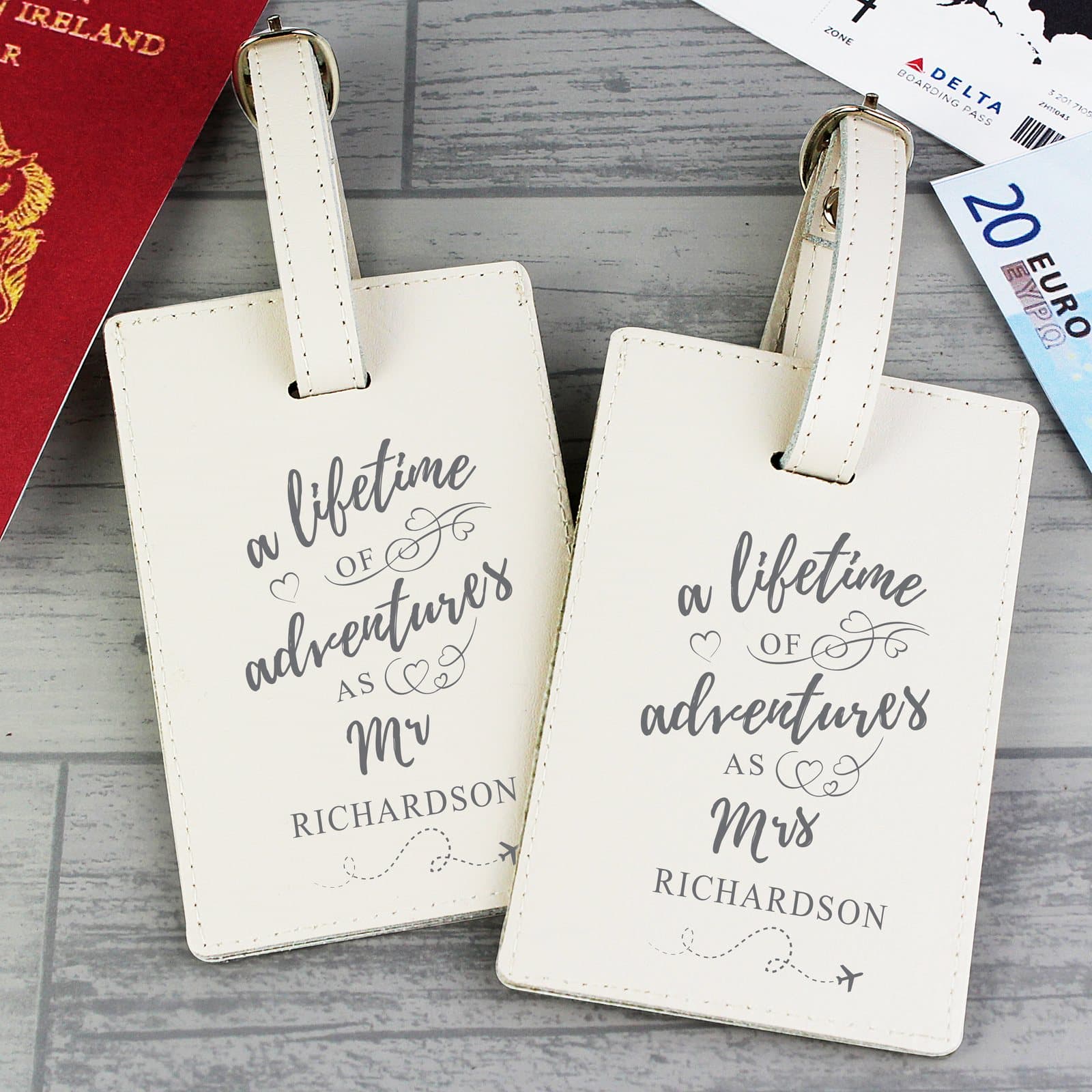 Pair of cream leather lifetime of adventures couples luggage tags