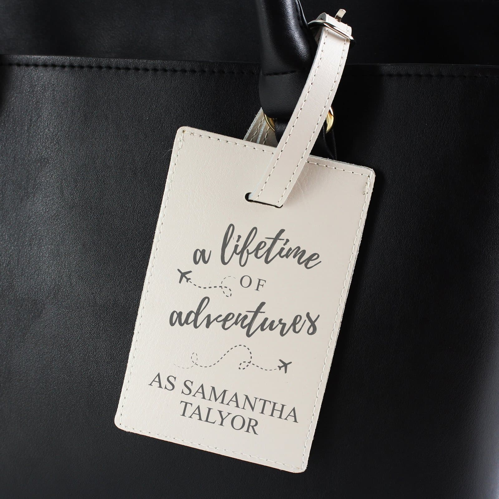 Cream leather luggage tag with a lifetime of adventures message