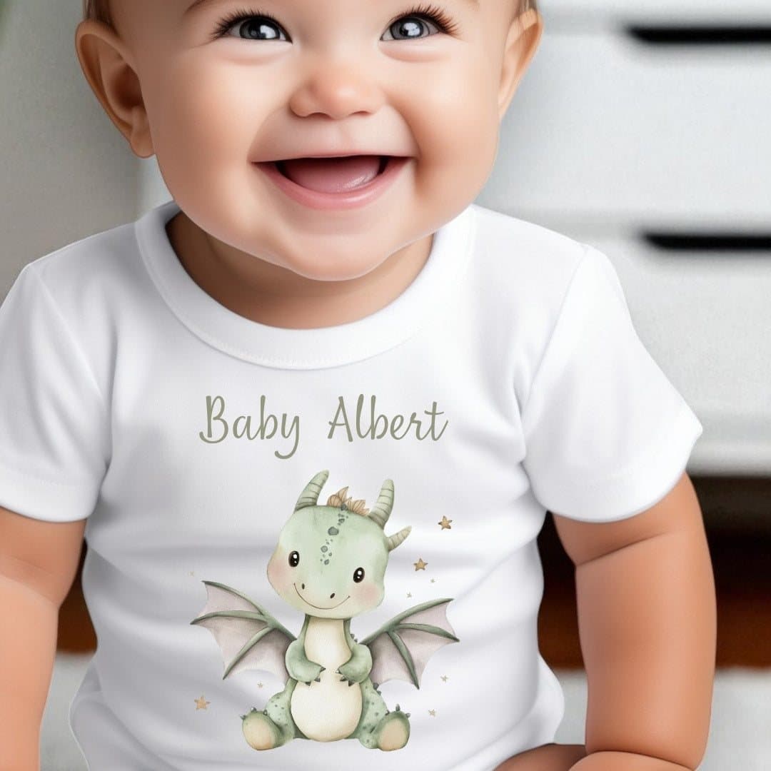 Personalised little green dinosaur baby grow with a name on it
