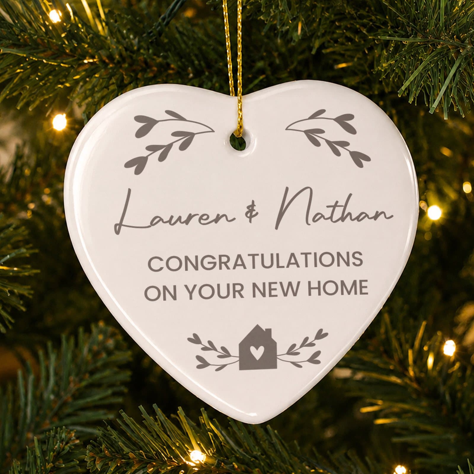 Ceramic heart decoration with personalised text and a ribbon
