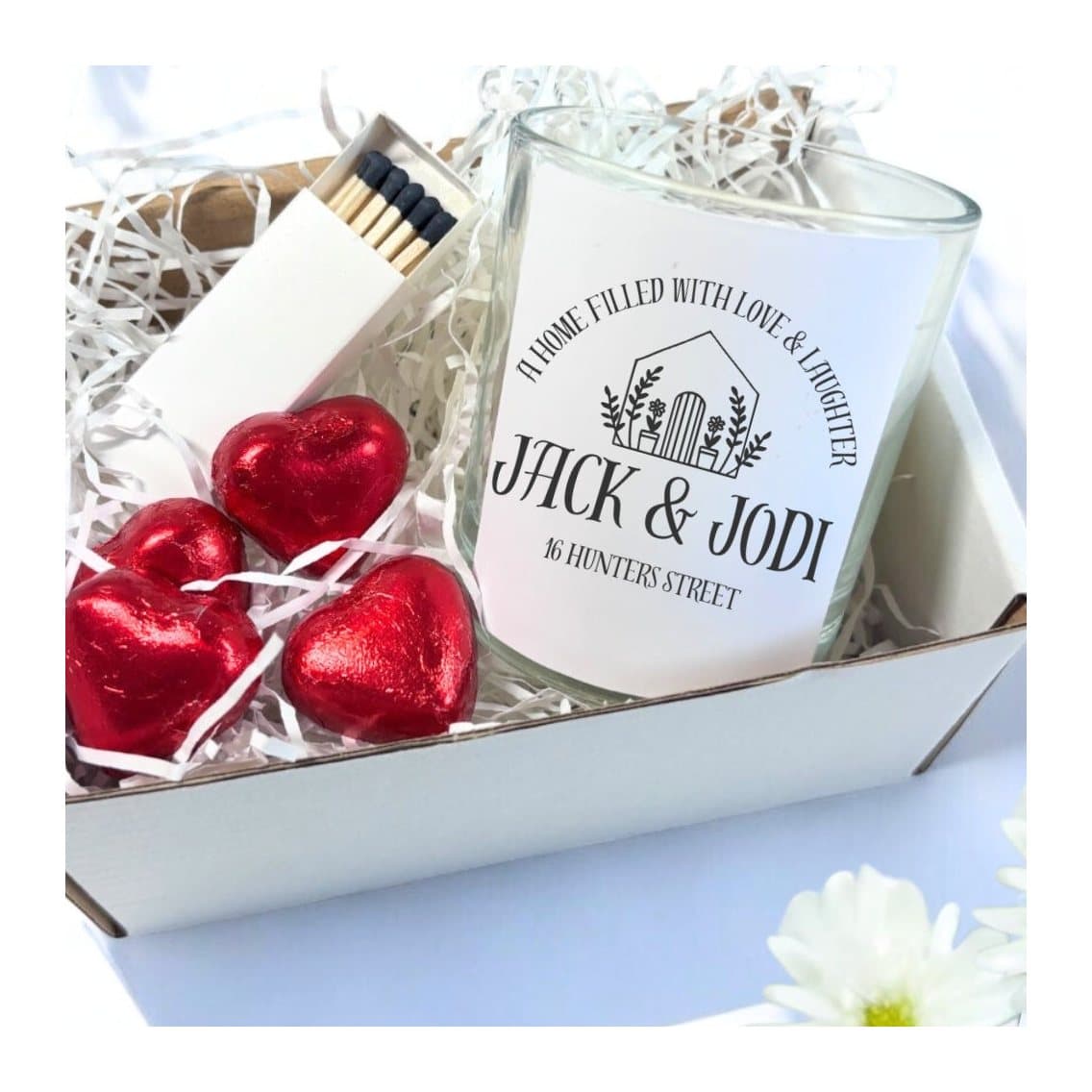 Personalised new home candle with a house and flowers design