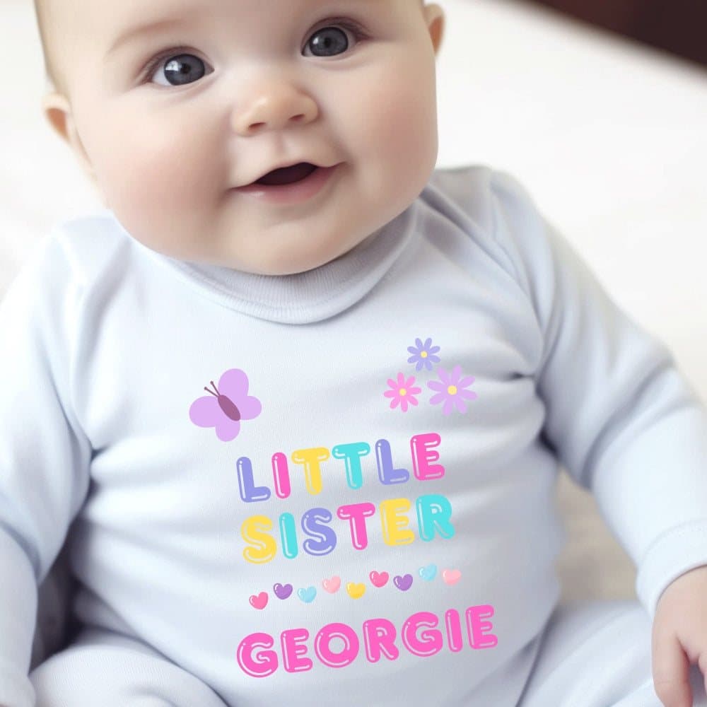Personalised little sister babygrow, vest or bib with the little sister artwork and a name