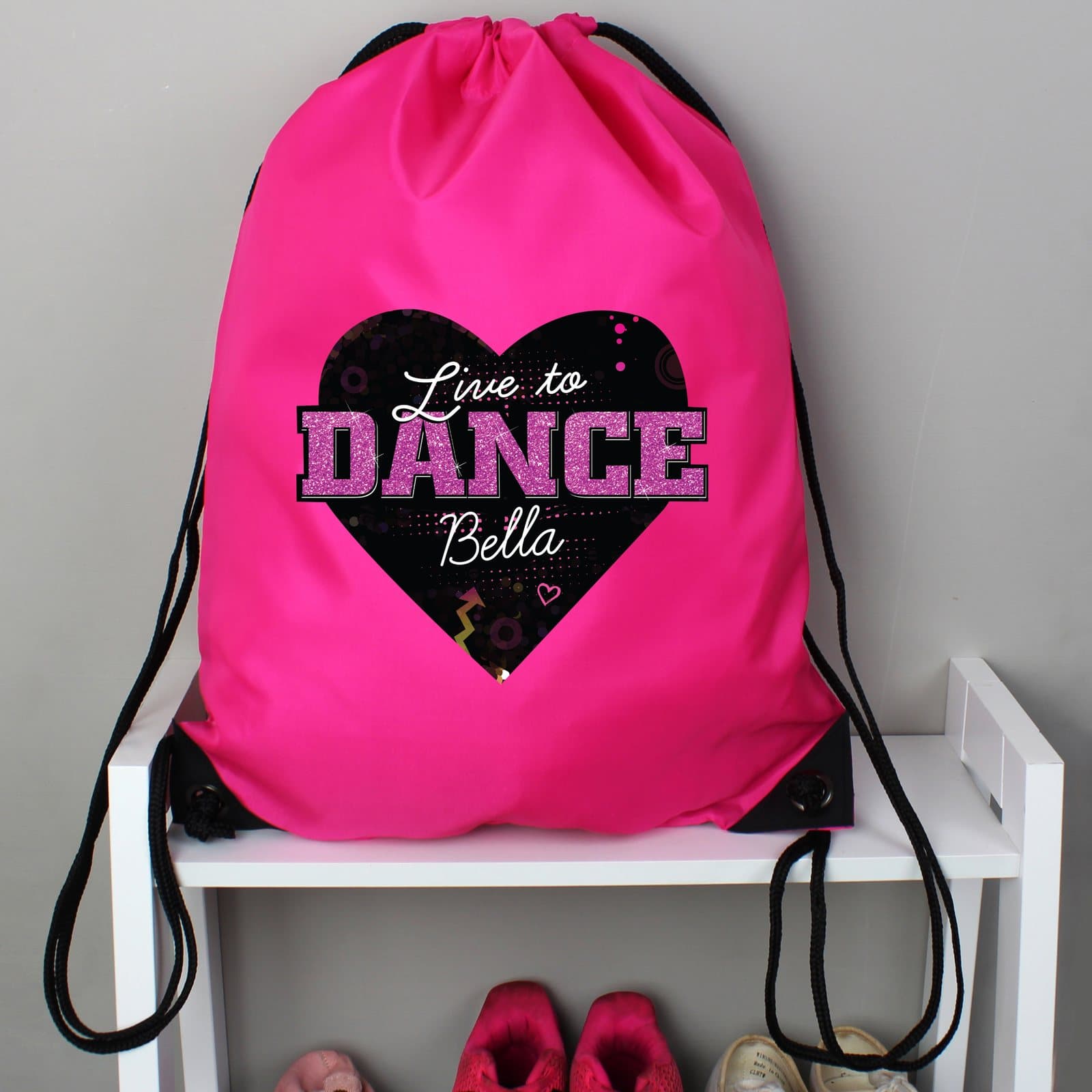 Pink drawstring kit bag with Live to Dance text
