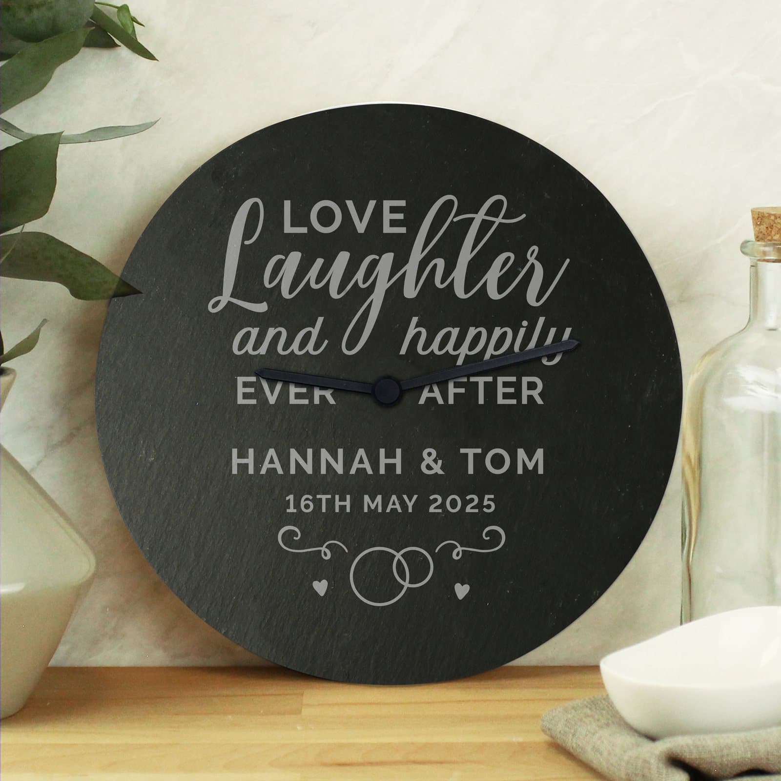 Rustic slate clock with the words Love Laughter and happily ever after