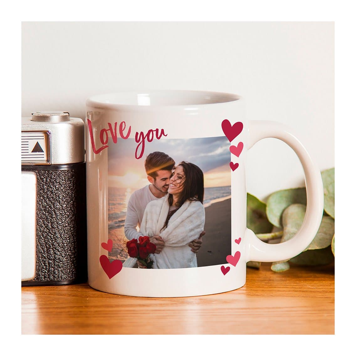Ceramic photo mug with a photo surrounded by hearts and Love you text