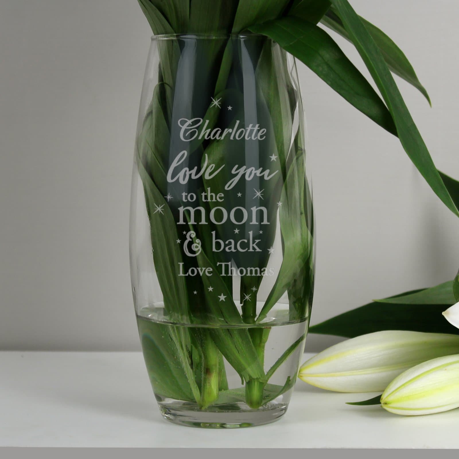 Glass bullet vase with love you to the moon and back text and a personalised message