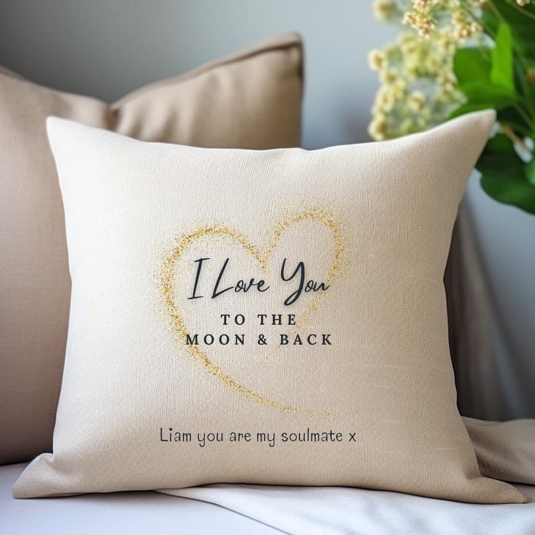 Cream square cushion with a golden heart and the words Love You to the Moon & Back