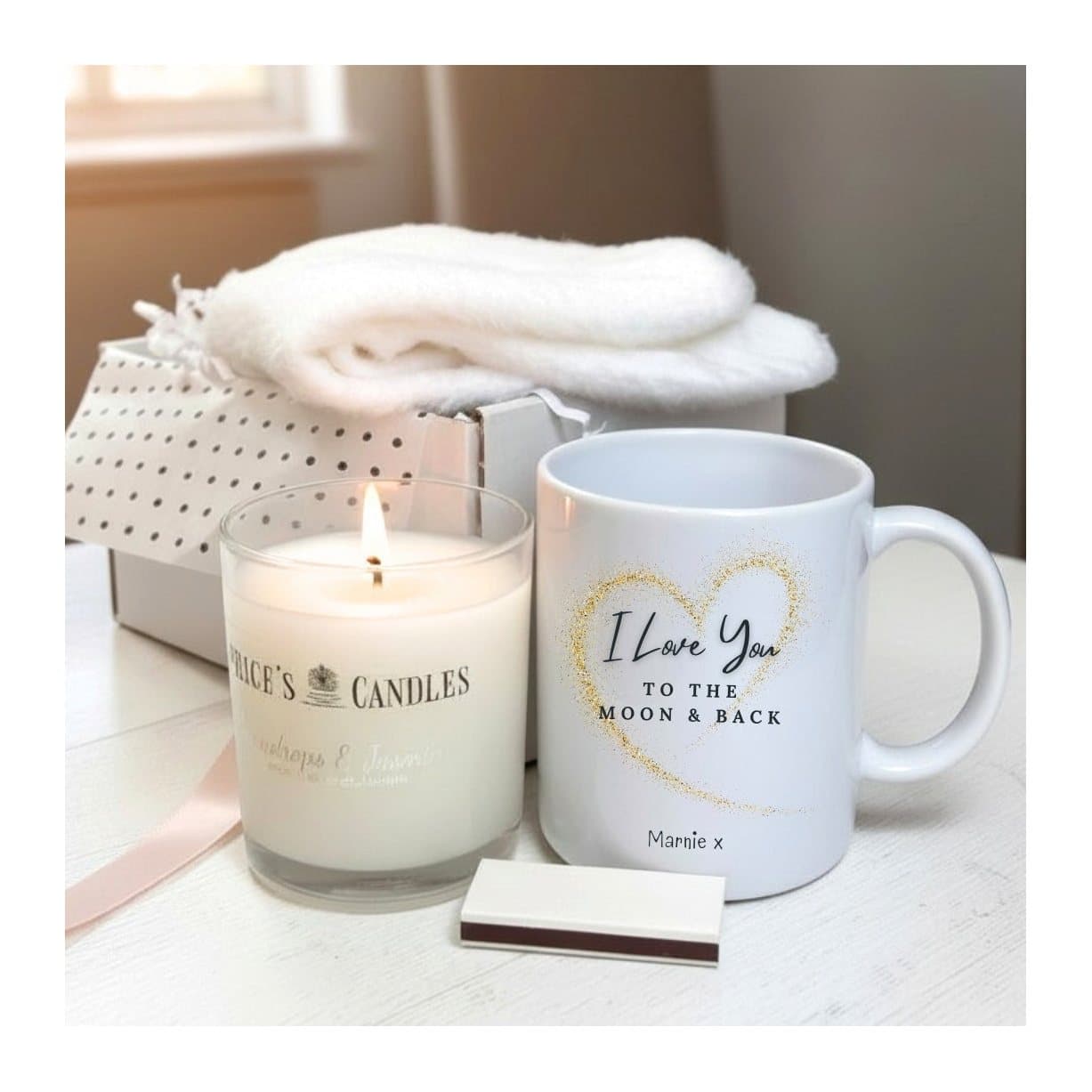 Love You to the Moon gift hamper with a mug, fluffy socks, scented candle and matches