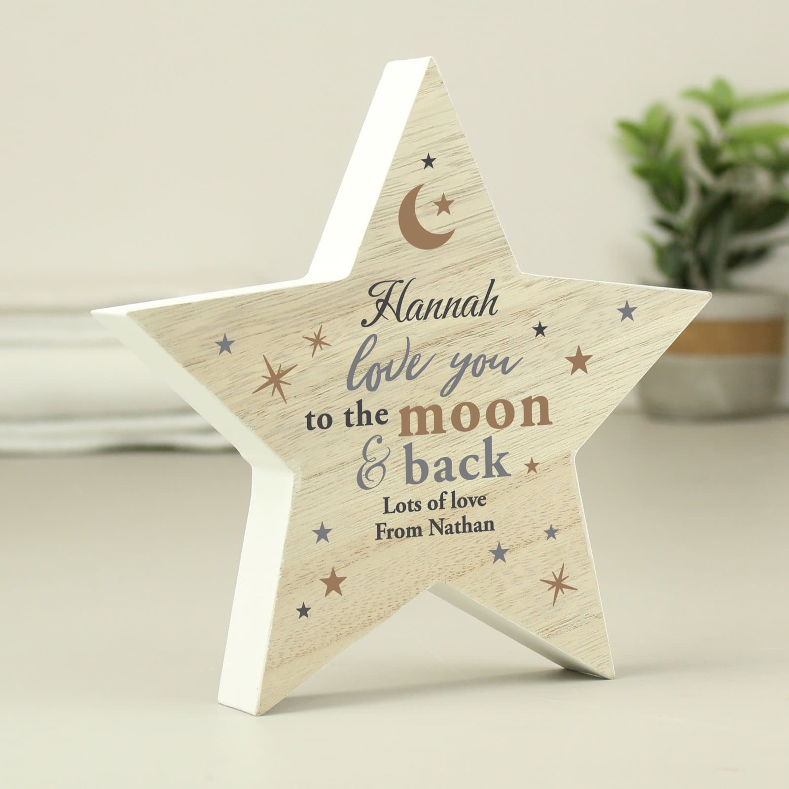 Rustic wooden star ornament with a name and love you to the moon and back text