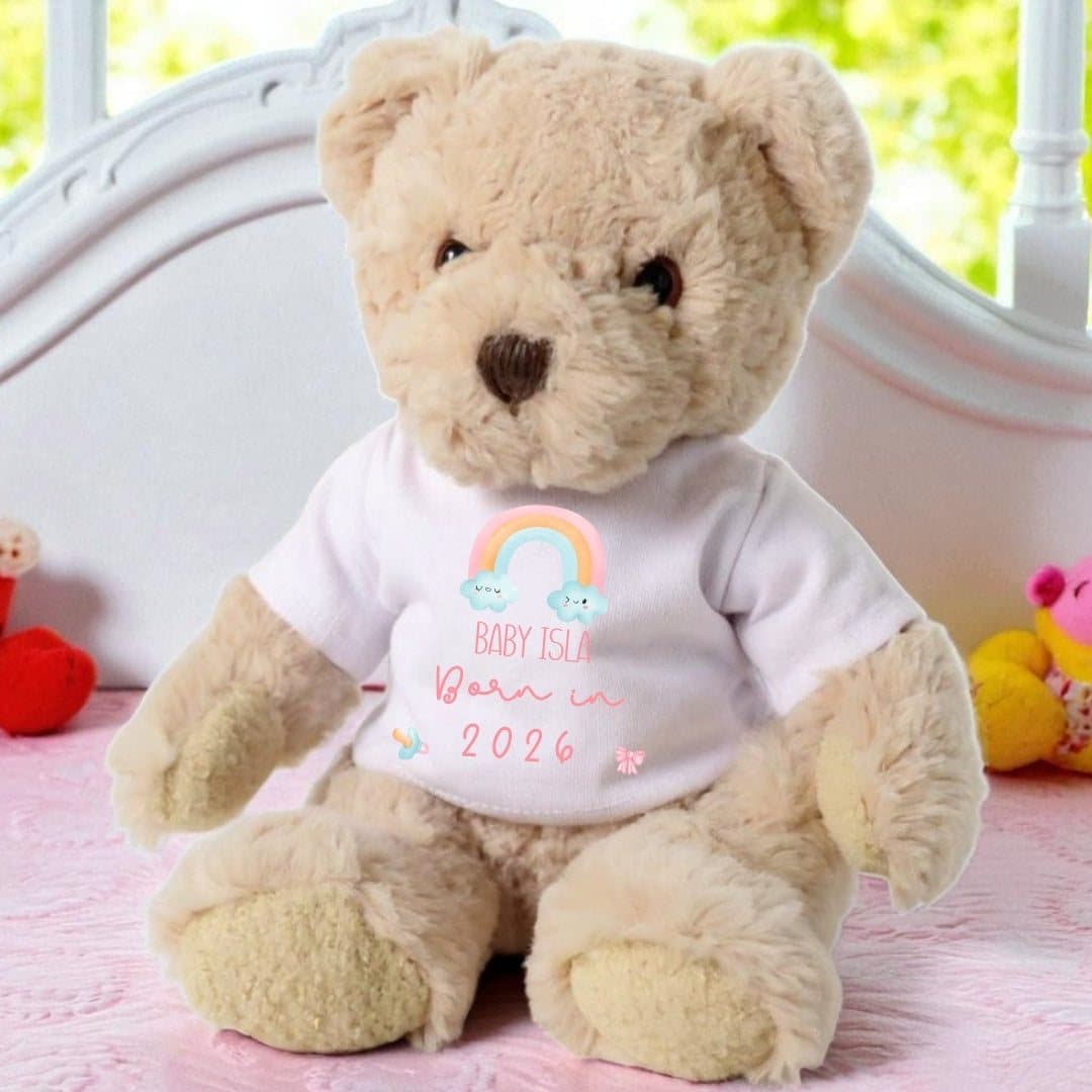 Personalised teddy bear in a rainbow Born in 2026 T-shirt with pink lettering