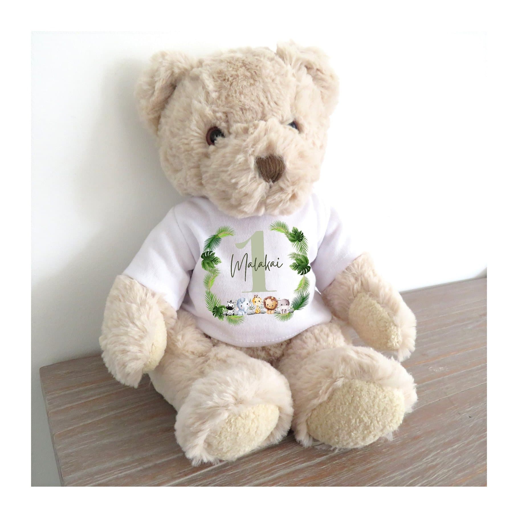 Teddy bear in a personalised T-shirt with five cute animals surrounded by greenery