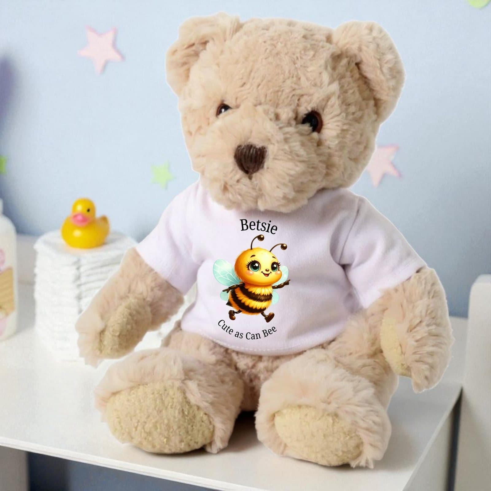 Personalised teddy bear wearing a T-shirt with a bee and Cute as Can Bee text