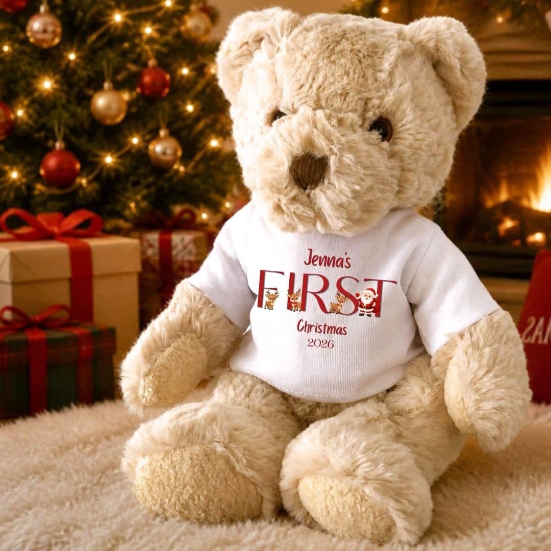 Teddy bear wearing a Santa and reindeer T-shirt with First Christmas 2026 text