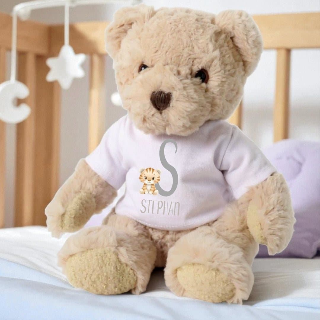Teddy bear in a T-shirt with a tiger design and a name printed on it