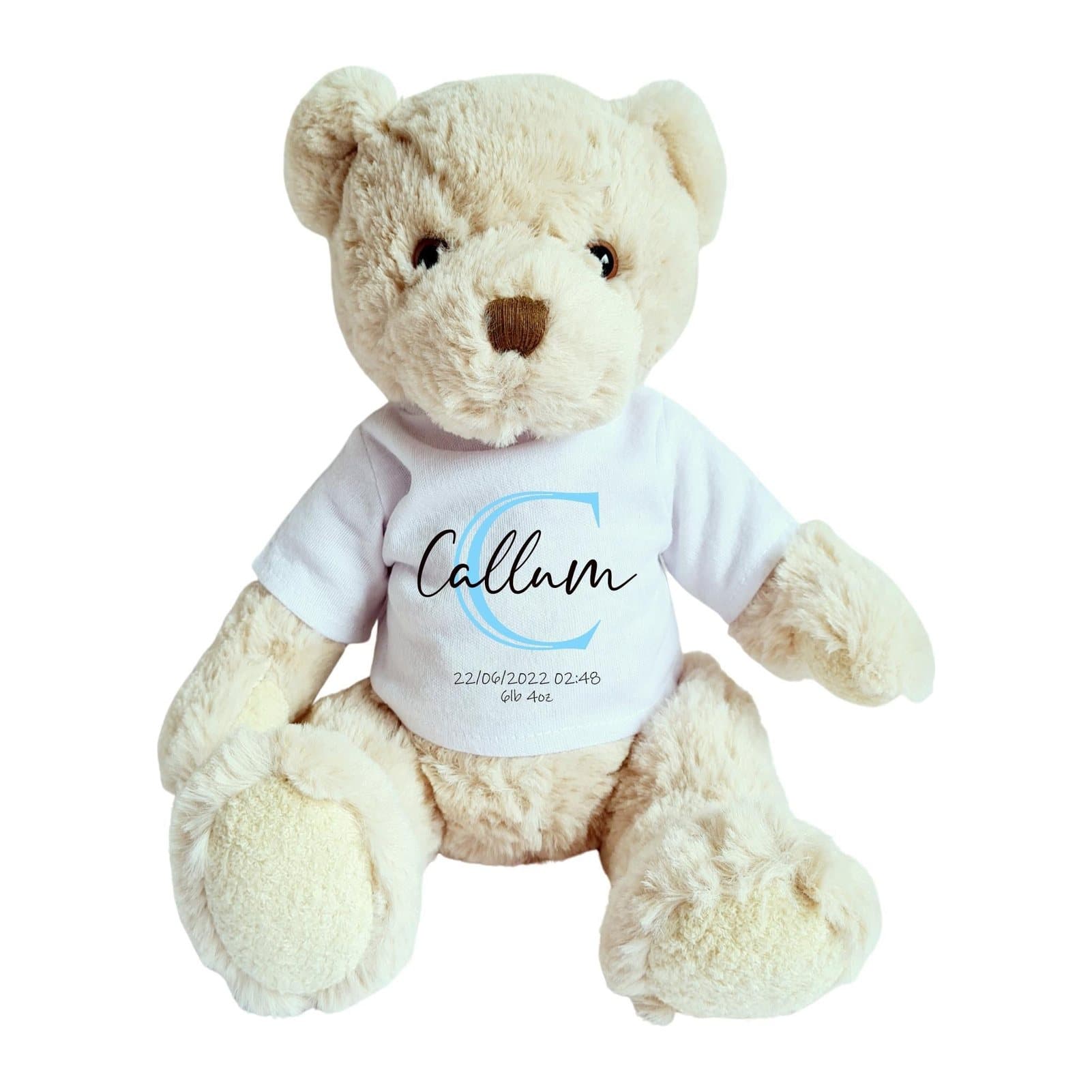 Teddy bear in a blue shirt with a printed initial, name and birth details