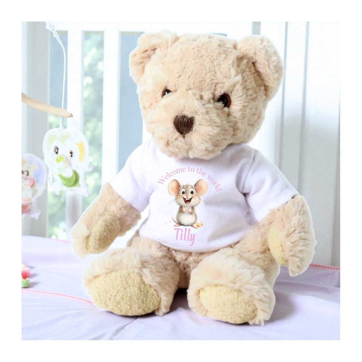 Teddy bear in a T-shirt with a pink mouse and welcome to the world design