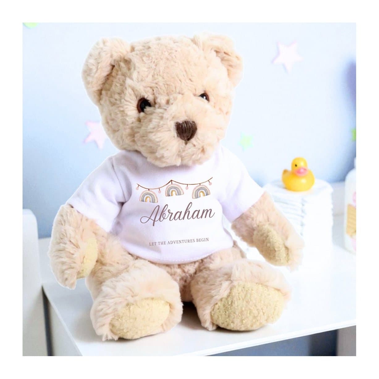 Personalised luxury teddy bear wearing a rainbow bunting printed T-shirt