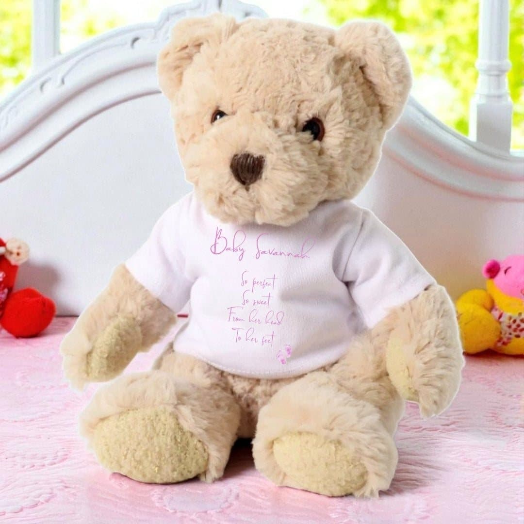 Teddy bear dressed in a T-shirt printed with So Perfect So Sweet and baby footprints