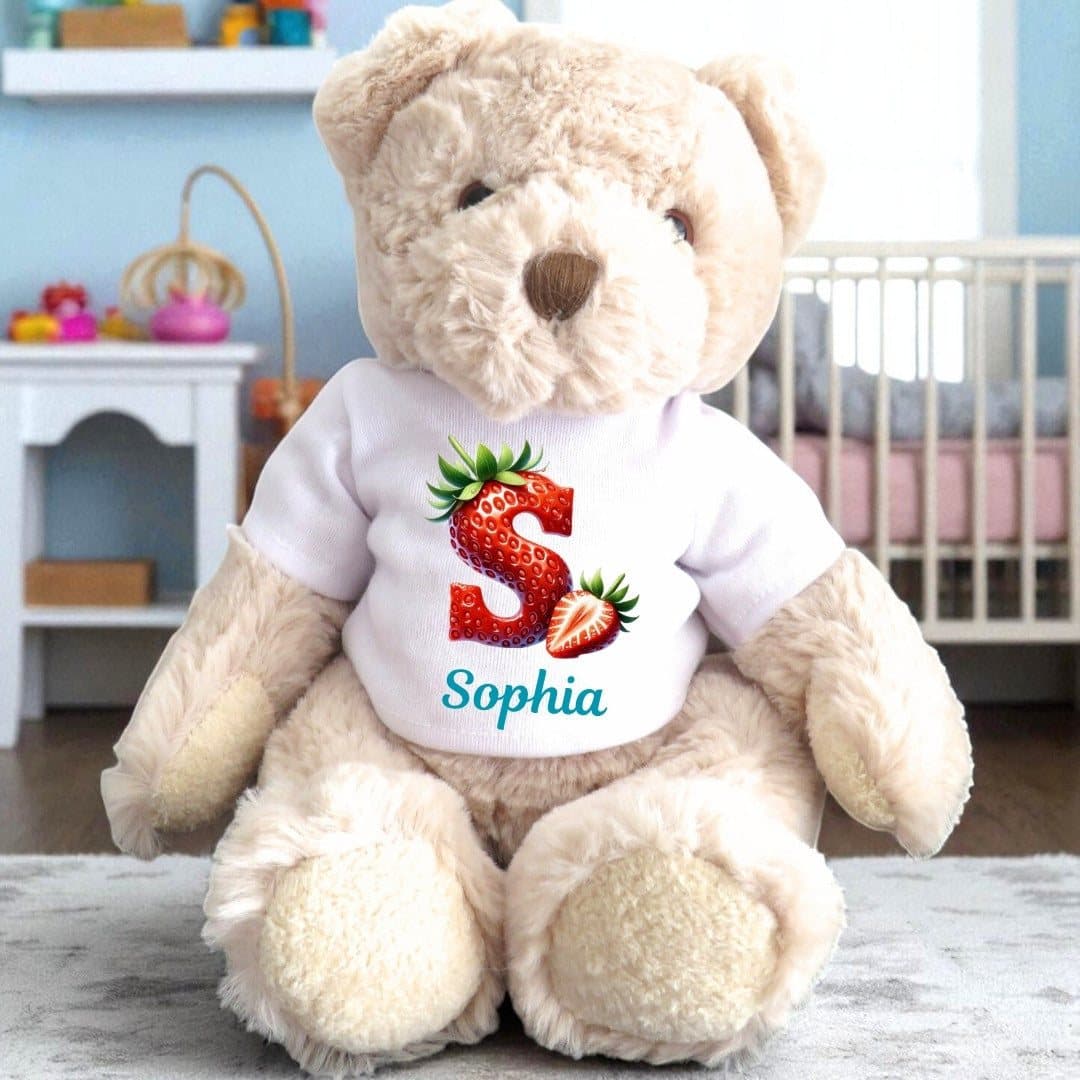 Personalised teddy bear in a T-shirt with a strawberry initial design and a name
