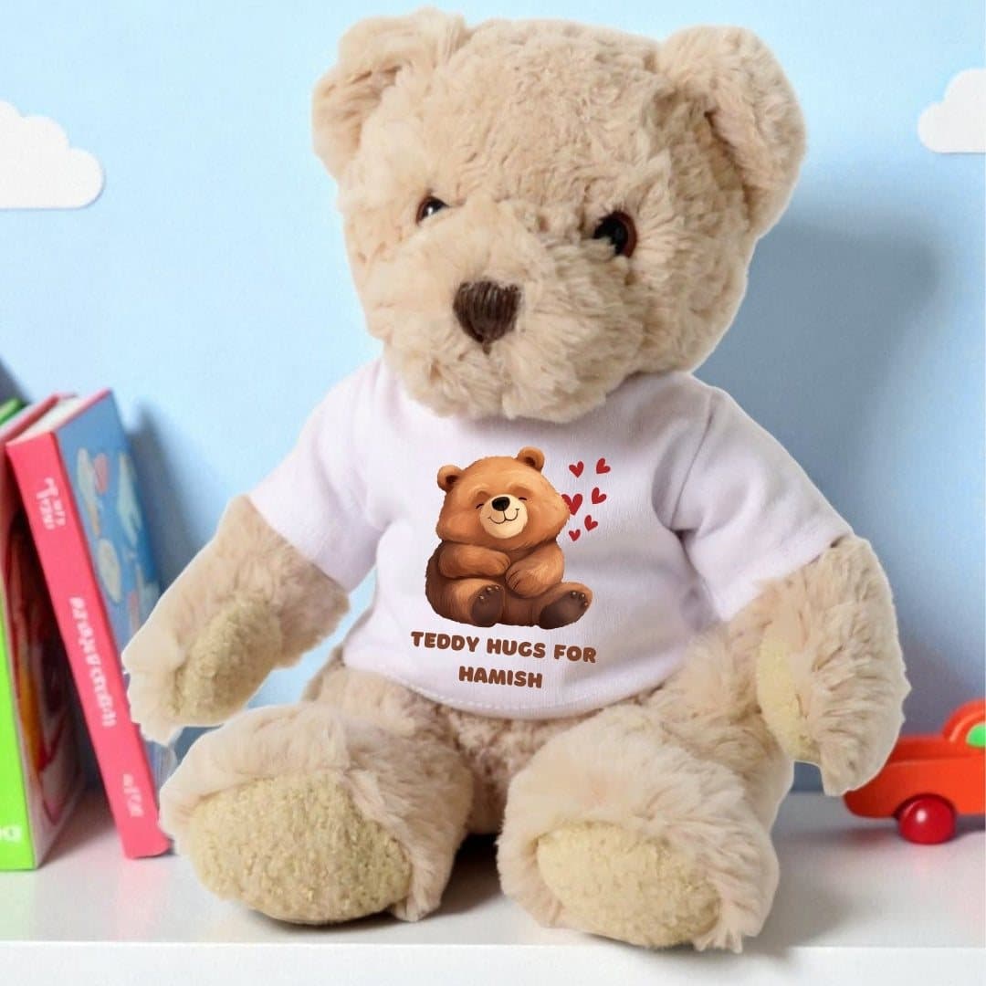 Teddy bear in a printed T-shirt with the wording Teddy Hugs for
