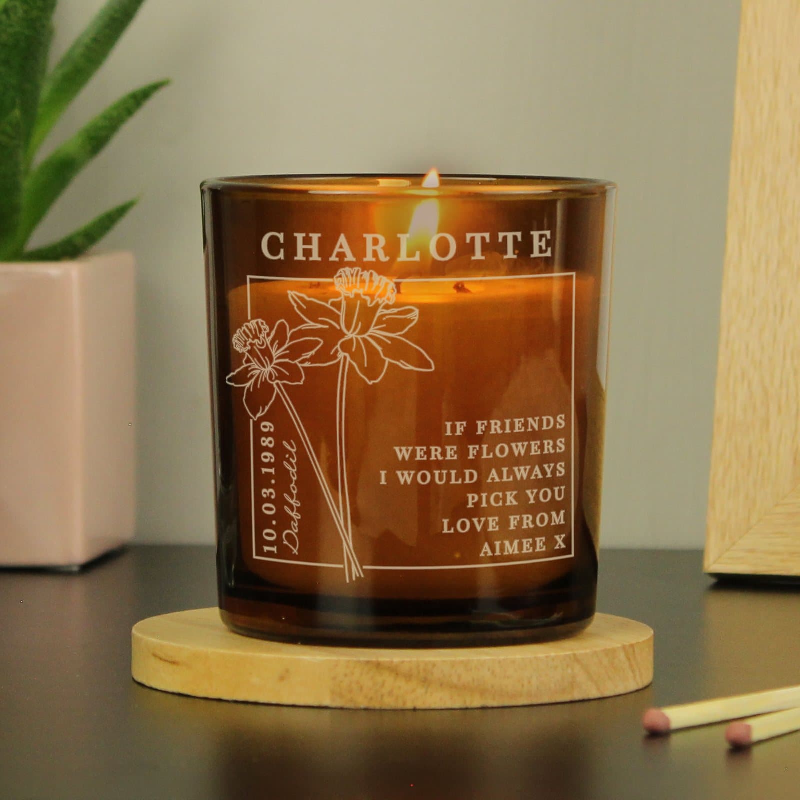 Amber glass candle jar personalised with a name, date and text